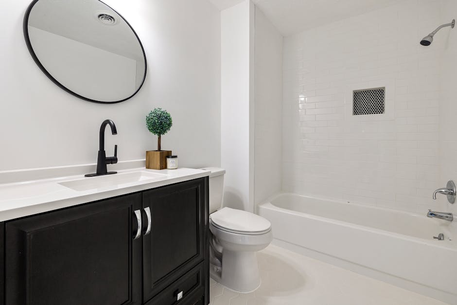 Bright and clean modern minimalist bathroom with sleek fixtures.